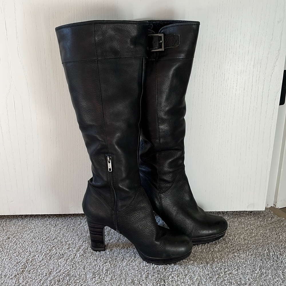 UGG knee high black stacked heel boots.